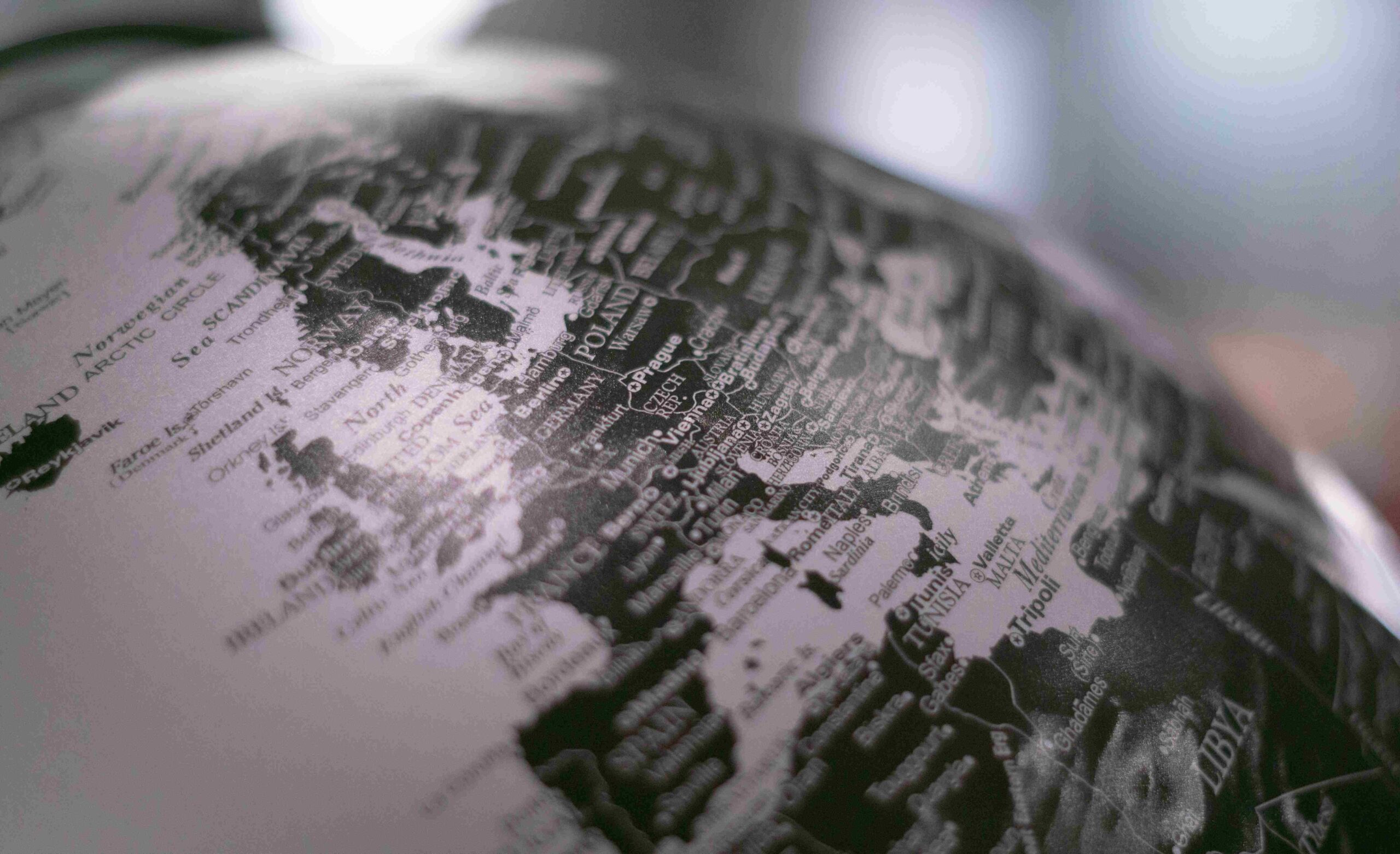An image of a black and white globe focused on Europe